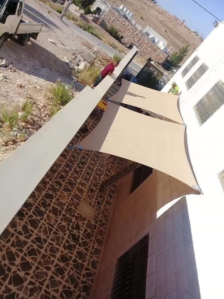 تركيب مظلات شد انشائي لتغطية الممرات